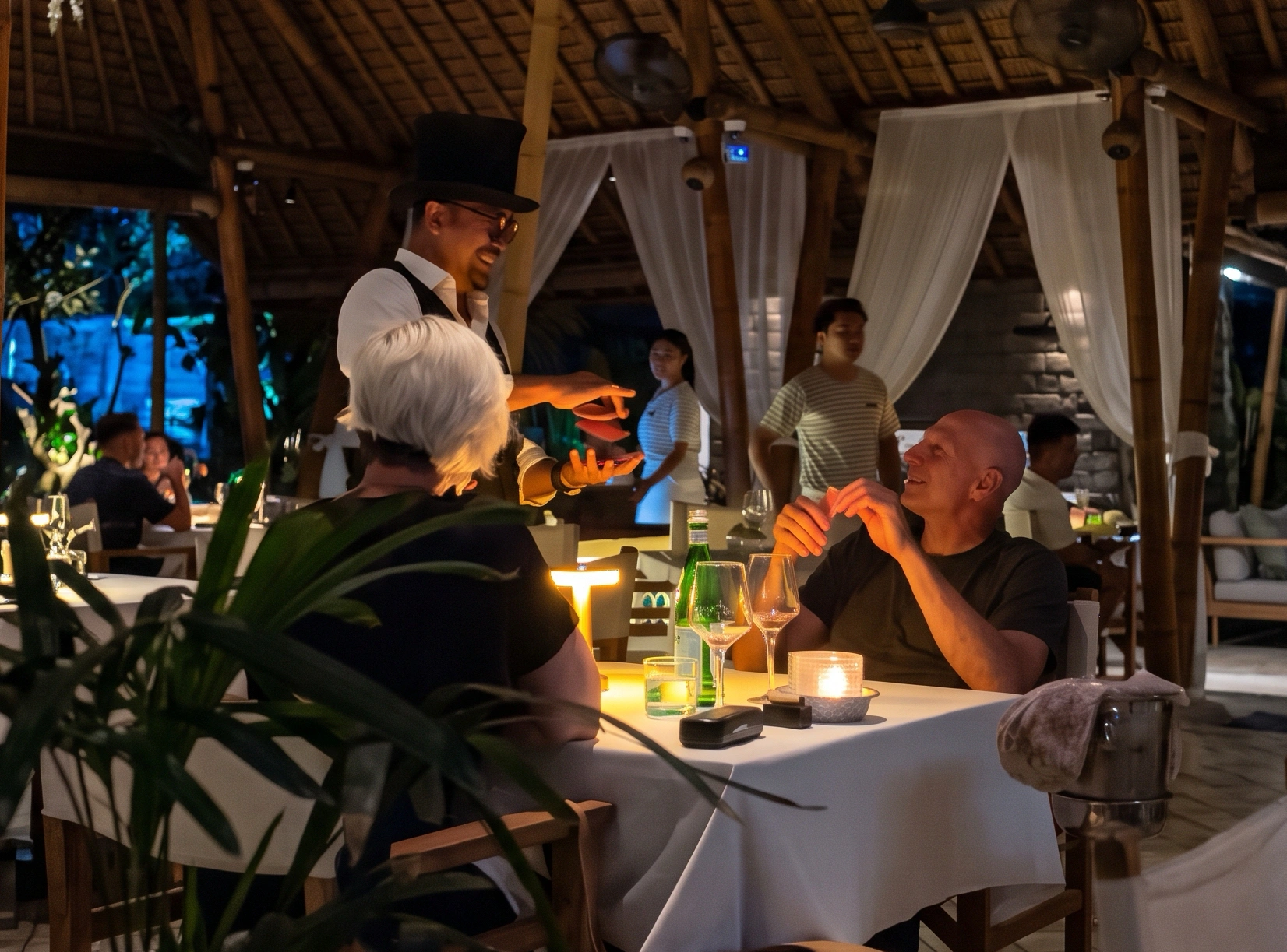 Family enjoying a magic show at Sardine, Bali entertainment for families and kids